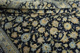 Close-up detail of 2000s Kashan rug from Iran / Persia showing Wool weave