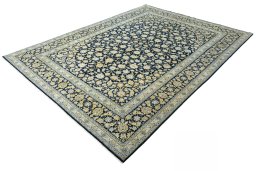 Corner detail of 2000s Kashan rug showing border pattern and Wool pile