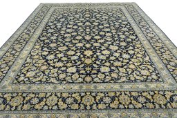 Surface texture of 2000s Kashan rug with natural Wool and intricate pattern