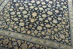 Close-up detail of 2000s Kashan rug from Iran / Persia showing Wool weave