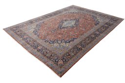 Corner detail of New Kashan rug showing border pattern and Cork pile