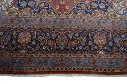 Full view of New Kashan rug from Iran / Persia, 403 × 292 cm in Red tones