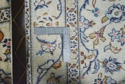 Close-up detail of 2000s Kashan rug from Iran / Persia showing Wool weave