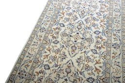Backside of handmade 2000s Kashan rug showing knot structure and weave density