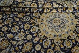 Close-up detail of 2000s Kashan rug from Iran / Persia showing Wool weave