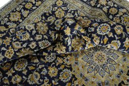 Surface texture of 2000s Kashan rug with natural Wool and intricate pattern