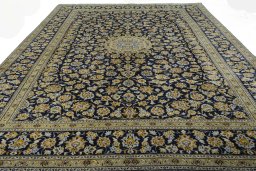 Surface texture of 2000s Kashan rug with natural Wool and intricate pattern
