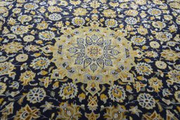 Central medallion detail of 2000s Kashan rug from Iran / Persia