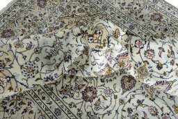 Surface texture of 2000s Kashan rug with natural Wool and intricate pattern