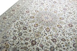 Backside of handmade 2000s Kashan rug showing knot structure and weave density