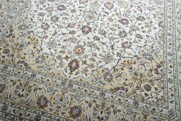 Close-up detail of 2000s Kashan rug from Iran / Persia showing Wool weave