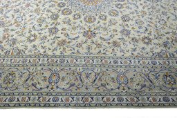 Corner detail of 2000s Kashan rug showing border pattern and Wool pile