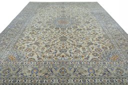 Surface texture of 2000s Kashan rug with natural Wool and intricate pattern