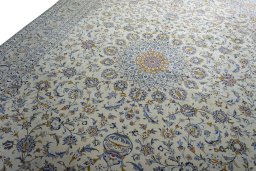 Backside of handmade 2000s Kashan rug showing knot structure and weave density