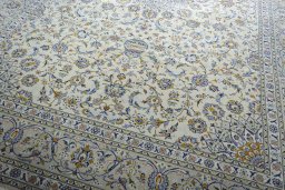 Close-up detail of 2000s Kashan rug from Iran / Persia showing Wool weave