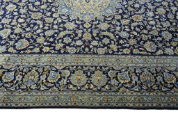 Corner detail of 2000s Kashan rug showing border pattern and Wool pile