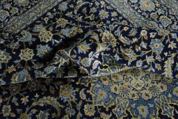 Surface texture of 2000s Kashan rug with natural Wool and intricate pattern
