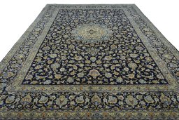 Surface texture of 2000s Kashan rug with natural Wool and intricate pattern