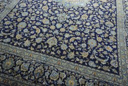 Close-up detail of 2000s Kashan rug from Iran / Persia showing Wool weave