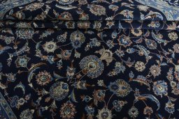 Close-up detail of 2000s Kashan rug from Iran / Persia showing Wool weave