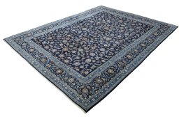 Corner detail of 2000s Kashan rug showing border pattern and Wool pile