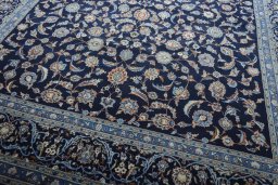 Close-up detail of 2000s Kashan rug from Iran / Persia showing Wool weave