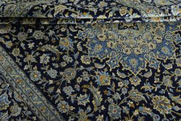 Close-up detail of 2000s Kashan rug from Iran / Persia showing Wool weave