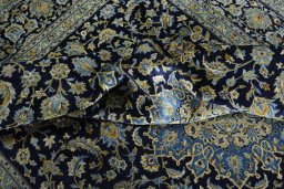 Surface texture of 2000s Kashan rug with natural Wool and intricate pattern