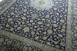 Close-up detail of 2000s Kashan rug from Iran / Persia showing Wool weave