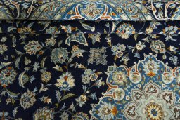 Close-up detail of 2000s Kashan rug from Iran / Persia showing Wool weave