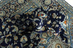 Surface texture of 2000s Kashan rug with natural Wool and intricate pattern