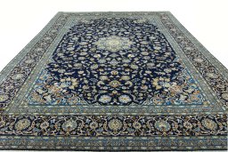 Surface texture of 2000s Kashan rug with natural Wool and intricate pattern