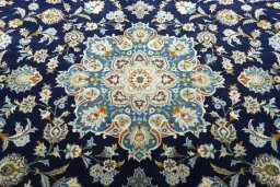 Central medallion detail of 2000s Kashan rug from Iran / Persia