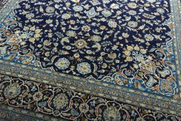 Close-up detail of 2000s Kashan rug from Iran / Persia showing Wool weave