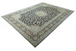 Corner detail of 2000s Kashan rug showing border pattern and Wool pile