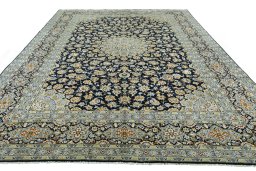 Surface texture of 2000s Kashan rug with natural Wool and intricate pattern