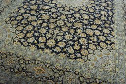 Close-up detail of 2000s Kashan rug from Iran / Persia showing Wool weave