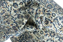 Surface texture of 2000s Kashan rug with natural Wool and intricate pattern