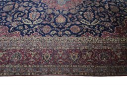 Corner detail of 1930s Kashan rug showing border pattern and Wool pile