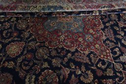 Close-up detail of 1930s Kashan rug from Iran / Persia showing Wool weave