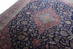 Backside of handmade 1930s Kashan rug showing knot structure and weave density