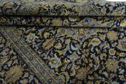 Close-up detail of 2000s Kashan rug from Iran / Persia showing Wool weave