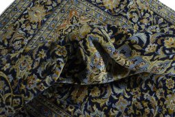Surface texture of 2000s Kashan rug with natural Wool and intricate pattern