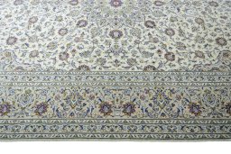Corner detail of 2000s Kashan rug showing border pattern and Wool pile