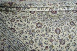 Close-up detail of 2000s Kashan rug from Iran / Persia showing Wool weave