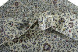 Surface texture of 2000s Kashan rug with natural Wool and intricate pattern