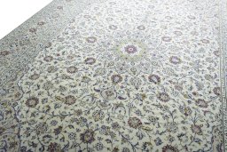 Backside of handmade 2000s Kashan rug showing knot structure and weave density