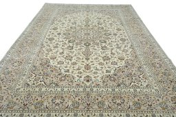 Surface texture of 2000s Kashan rug with natural Wool and intricate pattern