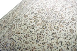Backside of handmade 2000s Kashan rug showing knot structure and weave density