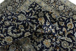Surface texture of 2000s Kashan rug with natural Wool and intricate pattern